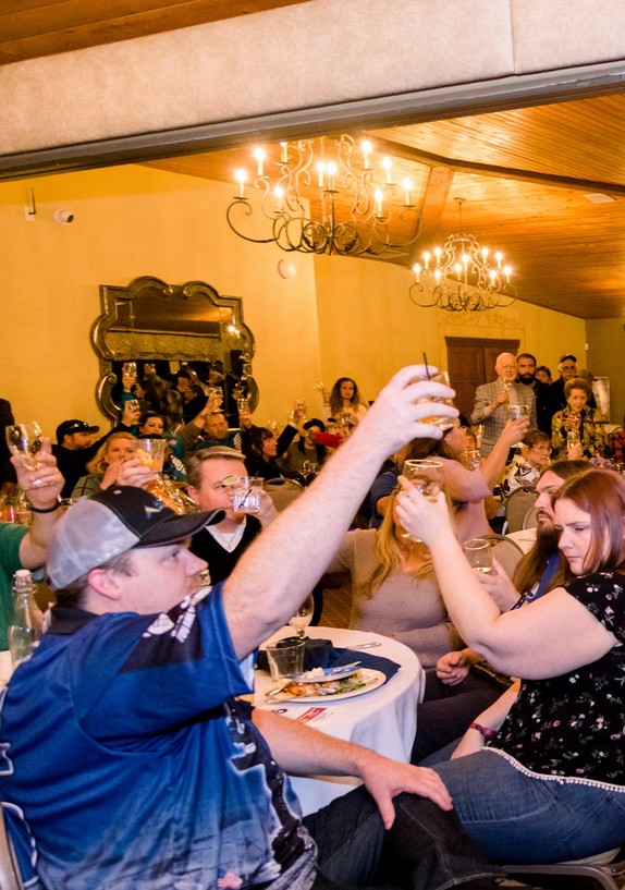 veterans and community giving a toast